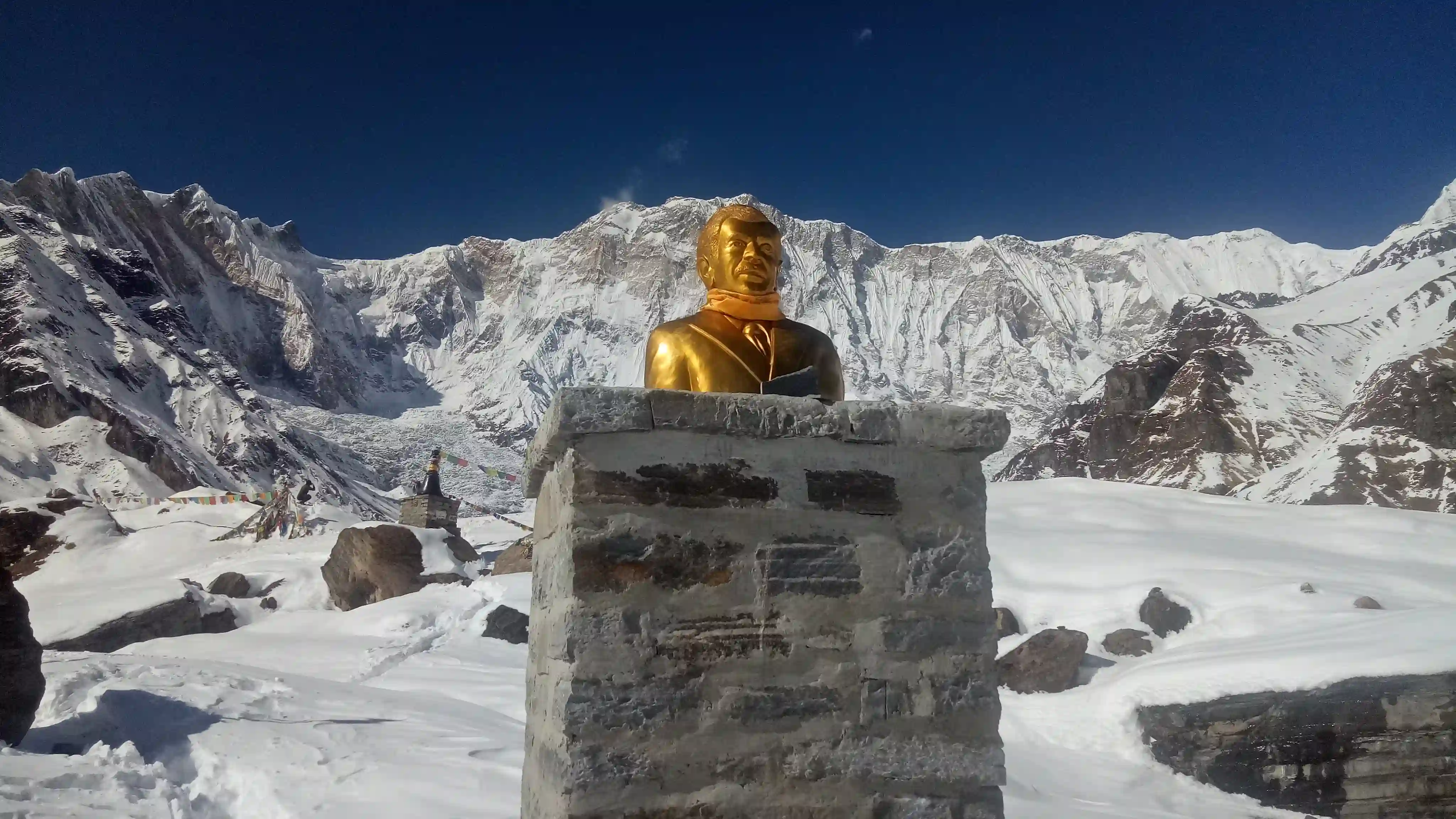 Statue with Snow-Covered Himalayan Mountains
